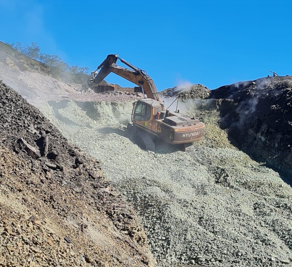 Excavator working on a bench