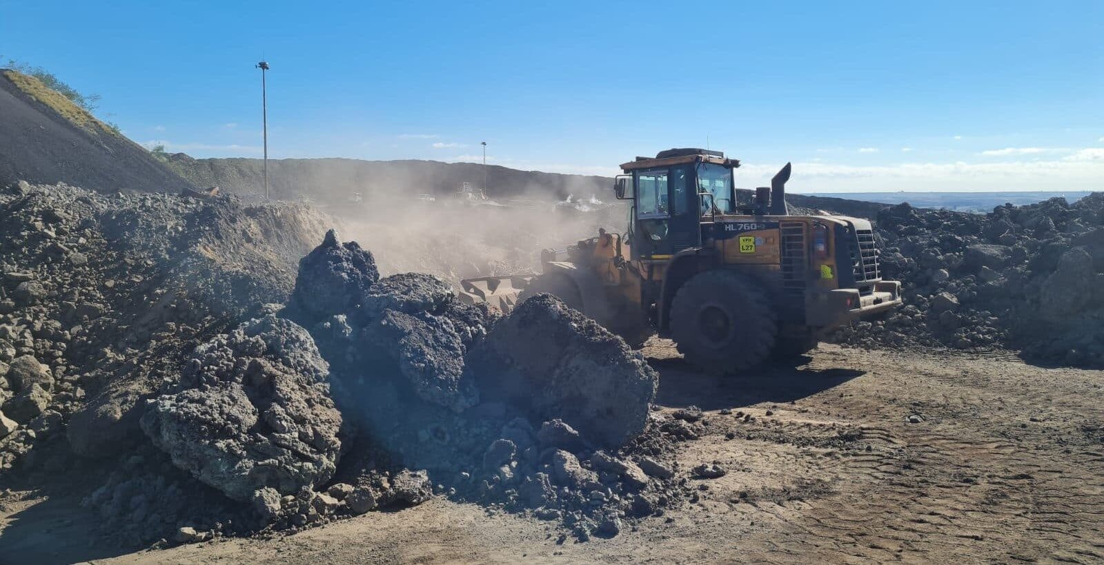 Front-end loader at a dump site